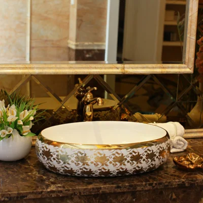 Chaozhou, lavabo de Color dorado, lavabo de cerámica para montaje en mesa, lavabo dorado moderno de cerámica ovalada con diseño Floral